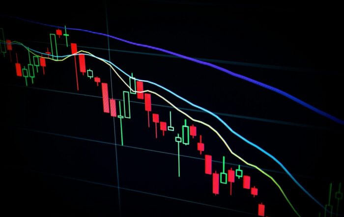 stock market candlestick chart on dark screen